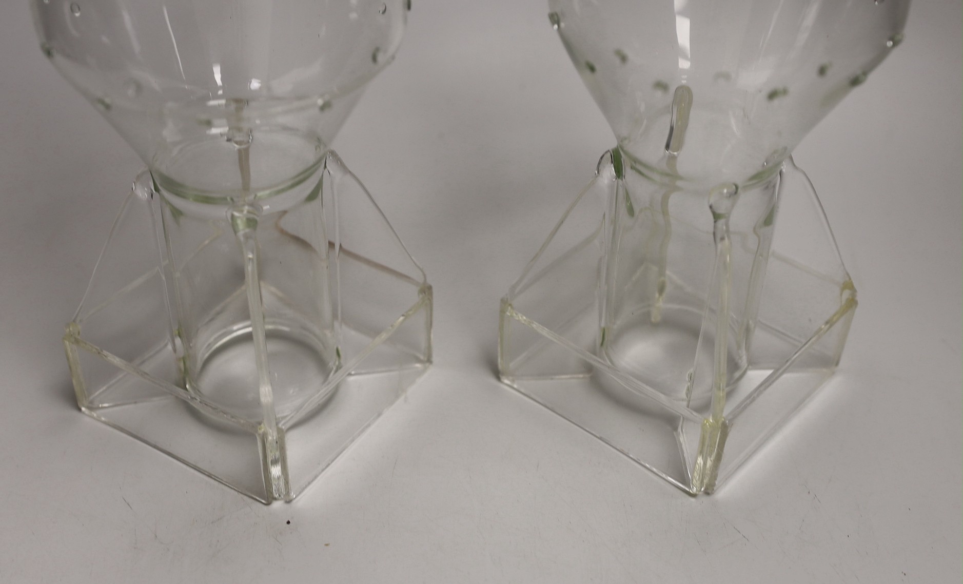 A pair of glass ‘hydrogen bomb’ shaped candleholders, 36cm tall